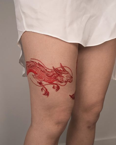 The year of the dragon 🐉✨. This red dragon tattoo wraps around the leg, and I really enjoyed creating this design. The result was amazing! Do you like the shades of red? ❤️ Thank you, Melissa, for your trust. Tattooed at @nobleart. #Tattoo #RedDragon #BodyArt #TattooArtist #InkArt #Color #Creativity #LegTattoo #ColorfulTattoo #TattooArt #PassionForInk #NobleArt Dragon Eating Tail Tattoo, Chinese Dragon Tattoos Thigh, Dragon Tattoo Korean, Dragon Wrapped Around Leg Tattoo, Dragon Tattoo On Leg, Dragon Tattoo Color, Thigh Dragon Tattoo, Dragon Leg Tattoo, Dragon Tattoo Leg