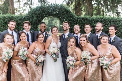 Rose gold sequin bridal party and gray suits with navy ties. Rose Gold Wedding Party Groomsmen, Gold Bridesmaid Dresses With Groomsmen, Rose Gold Groomsmen Attire, Rose Gold Bridal Party, Rose Gold Wedding Party, Gold Bridal Party, Bridal Party Groomsmen, Gray Suits, Gold Magic