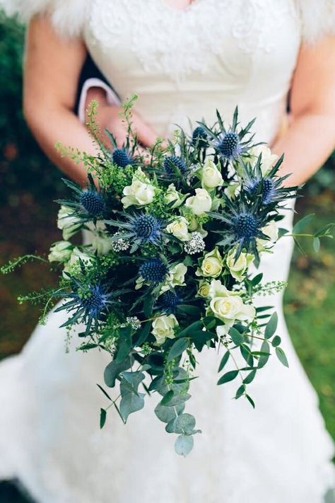 Bride's Gorgeous Bouquet Features: Ivory Spray Roses, Blue Eryngium Thistle, Green Eucalyptus + Additional Greenery and Foliage Thistle Wedding Flowers, Thistle Bouquet Wedding, Thistle Bouquet, Hand Tied Bridal Bouquet, Winter Bridal Bouquets, Small Bridal Bouquets, Thistle Wedding, Holly Wedding, Bridal Bouquet Blue