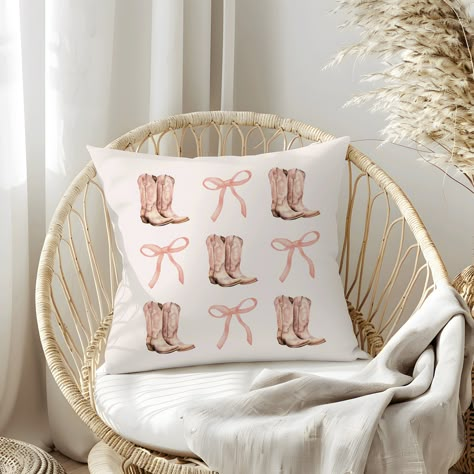 Our Coquette Cowgirl Pillow, featuring a Pink Bows Aesthetic and Cowboy Boots, is perfect for a Country Home Decor. This Bows and Boots Pillow makes an ideal Gift for Cowgirl Decor and a Cute Gift for Her Teen Room Decor.   Light tan pillow with boots and bows. 𝐌𝐀𝐓𝐂𝐇𝐈𝐍𝐆 𝐒𝐇𝐈𝐑𝐓 & 𝐓𝐎𝐓𝐄 𝐀𝐕𝐀𝐈𝐋𝐀𝐁𝐋𝐄 (𝐋𝐈𝐍𝐊𝐒 Shirt:  https://www.etsy.com/listing/1716212536/coquette-bow-shirt-summer-tshirt-comfort Tote:  https://www.etsy.com/listing/1713532536/cowgirl-tote-coquette-aesthetic Pink Country Aesthetic Room, Pink Cowgirl Bedroom, Cowgirl Pillows, Cowgirl Room Ideas, Cowgirl Bedding, Bows Aesthetic, Cowgirl Bedroom, Cowboy Pillow, Tan Pillow