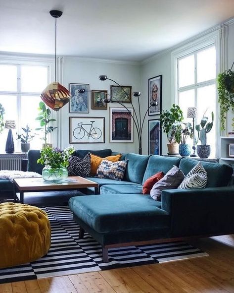 a Scandinavian inspired living room with light blue walls, a navy sectional, a bold gallery wall and touches of copper and black Blue Sofa Living, Living Room Indian, Budget Living, Sofa Design Ideas, Furnitur Ruang Keluarga, Blue Couch, Light Blue Walls, Indian Living Rooms, Ikea Design