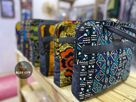 These collection of laptop/handbags are made with quality ankara/African print fabrics and a touch of jeans/leather. Carefully crafted to suit all your clothing and gadgets. Comes in a size of 16 inches by 13 inches. We do wholesale and retail. Send us a WhatsApp message +233240926564 Worldwide shipping assured Ankara Laptop Bags, African Print Bags, Laptop Handbags, Traveling Bag, Laptop Handbag, African Accessories, Bag Designs, Blue City, Whatsapp Message