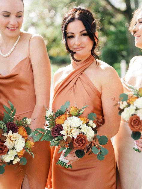 Bouquet Size: 11.4 inch W x 13 inch HPakcage: 1 * Bridesmaid BouquetMaterials: Crafted from silk and foam flowers, this bouquet boasts a harmonious ensemble of dahlia, roses, peonies, and eucalyptus.Details: This artificial flower bouquet is the perfect accessory for fall weddings. Its terracotta, cream, burgundy, and grey-green color scheme perfectly complements the autumnal hues that are often seen during this season.Adds a touch of warmth and depth to your fall wedding: With its warm and rich colors, this bouquet adds a touch of warmth and depth to any fall wedding. It's a perfect way to incorporate the natural beauty of the season into your wedding decor.Note: The bouquet may arrive a bit deformed, please use a hair dryer to fluff up the leaves and flowers. Bridesmaid Bouquet Burnt Orange, Rust Bridesmaid Dress Bouquets, Fall Color Bouquet Brides, Bridesmaids Fall Bouquets, Fake Flower Bridesmaid Bouquet, Bridemaids Small Bouquets, Marigolds Wedding Bouquet, Fall Bridal Flowers Bouquet, Fall Bridesmaid Flowers Bouquets