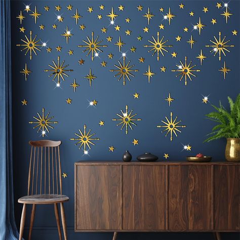 PRICES MAY VARY. Gold Star Stickers total contain: 5.9 x 7.9 inches per sheet, 6 sheet, (Abstract Star-size: 4.2’’Hx4.2’’W to 5.5’’Hx5.5’’W, Small Star-size: 2.7’’Hx1.9’’W to 0.87’’Hx0.84’’W). Easy to peel and stick: Sparkly Starburst art wall murals is made of quality acrylic material, with adhesive on the back, which can make it easy to install without tools. Retro Star Wall Decals: Self adhesive, easy and convenient to use, removable without sticky residue. Gold Acrylic Mirror Decals Decor: M Boys Bedroom Space Theme, Sticker Display Ideas Wall Art, Starry Bedroom, Sparkly Decor, Gender Neutral Bedroom Kids, Celestial Bedroom, Magical Room Decor, Blue Green Bedrooms, Celestial Nursery