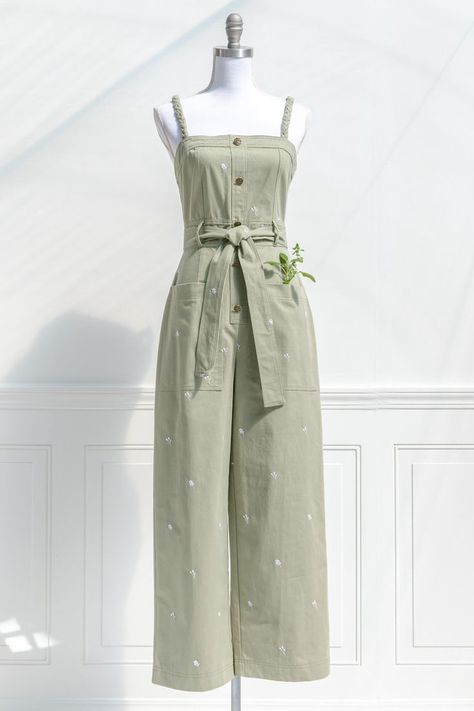 An image of a sage green canvas women's jumpsuit with delicate floral embroidery throughout, a waist tie, front pockets, and braided straps on a dress form mannequin in front of a vintage style Parisian white wall. Design Moda, Fashion Top Outfits, Cute Dress Outfits, Trendy Dress Outfits, Casual Day Outfits, Quick Outfits, Fesyen Hijab, Easy Trendy Outfits, French Countryside