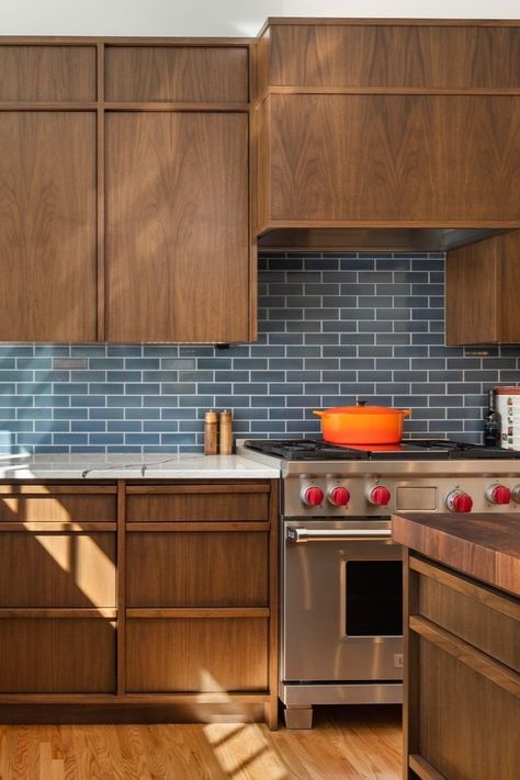 I spy a perfect place to meal prep 🍴 —— Blue tile, dark walnut cabinets, kitchen appliances, SubZero stove, countertop, kitchen island. Kitchen With Blue Tiles, Walnut And Blue Kitchen, Blue Tiled Kitchen, Stove Design Kitchen, Dark Countertop Kitchens, Dark Wood House Interiors, Dark Walnut Cabinets, New Build Kitchen Ideas, Blue And Wood Kitchen