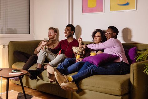 Happy Cheerful Friends Watching Tv by Boris Jovanovic Watching Tv Pose Reference, Friends Couch Photoshoot, Watching Tv Photography, Watching Tv With Friends, Friends Watching Tv, People Watching Tv, Family Watching Tv, Watching Tv Together, Block Core