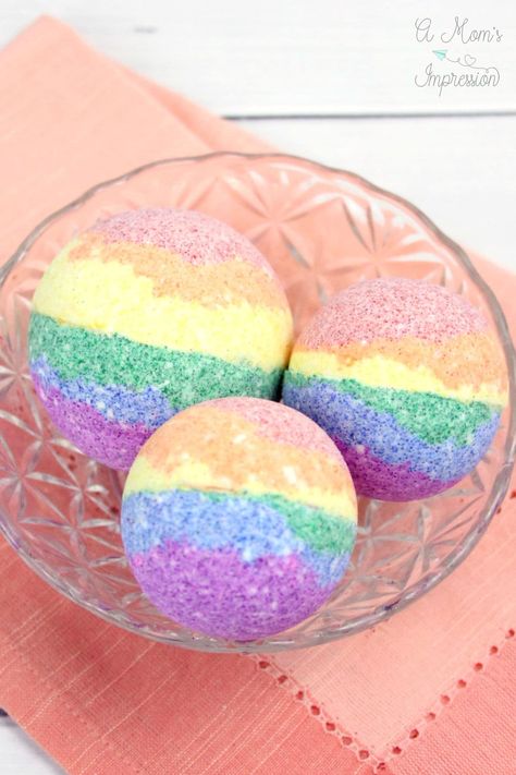 This fun DIY Homemade Rainbow Bath Bomb recipe is easy to make and a fun activity to do with kids. #bathbomb #crafts #kidsactivities #rainbow