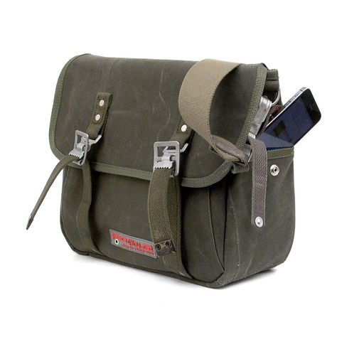 Olive Messenger Bag Classic Messenger  Cross Body Bag is an all original upcycled, recycled  messenger bag,  made from a German Army duffel bag, which is still vibrant and very much alive.  This Messenger Bag, emulates a model of an  US-army bag from 1943. Inside there are three useful open pockets.  Outside there are one pocket at the backside and  a small pocket on the right side for i-phone and so on. Model: anton-2080 * Outside: recycled german navy kitbag,  * Lining: Oxford Nylon ( wateresi Military Messenger Bag, Army Bag, Upcycled Bag, Leather Duffel Bag, Leather Duffel, Laptop Messenger Bags, Canvas Messenger Bag, I Phone, Cute Bags