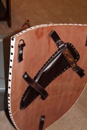 Heater Shield, Medieval Shield, Diy Heater, Medieval Shields, Elf Warrior, Wooden Shield, Leather Factory, Medieval Armor, 12 Steps