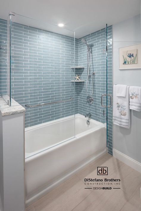 Coastal Design | Nautical Design | Custom Shower | Bathroom Remodel | Bathroom Design | Ocean Road Oasis Small Bathroom Lighting, Bathroom Tile Design Ideas, Bathroom Tub Shower Combo, Coastal Bathroom Design, Teen Bathrooms, Tile Design Ideas, Tile Tub Surround, Blue Bathroom Tile, Beach House Bathroom