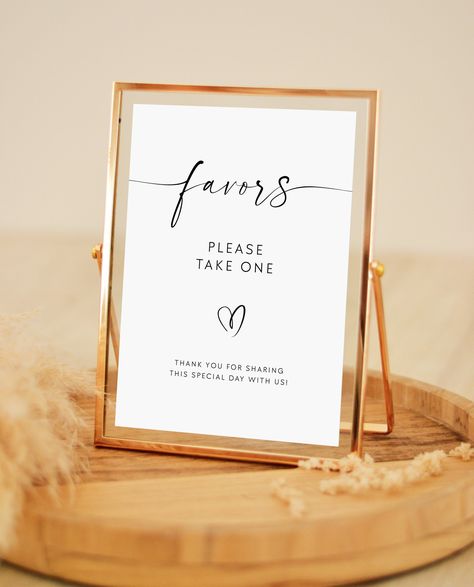 "This is an editable modern wedding favors table sign template. It has an elegant minimalist aesthetic notifying your guests to take a wedding favor for themselves. This sign is available in 5 sizes: A4, A5 (AU/UK Size), 4x6\", 5x7\" and 8x10\". ➡️ If you need it in another size, please message me and I'll be more than happy to create it for you. ✔️ Fully editable wording, font and colors ✔️ Edit colors of elements and background ✔️ Edit ➡ Save ➡ Download ➡ Print! PLEASE NOTE - - - - - - - - - - - * This is a digital template, which can be edited in your browser on your computer.  NO physical product will be delivered.  * Once you finish editing it, it can easily be downloaded and printed anywhere you please. (See my FAQ for possible places to print❤️) SHOP LAUNCH SALE - - - - - - - - - - Wedding Favour Display, Wedding Favor Signs, Party Favor Sign, Wedding Favor Sign, Elegant Minimalist Wedding, Modern Wedding Favors, White Wedding Favors, Favors Table, Background Edit