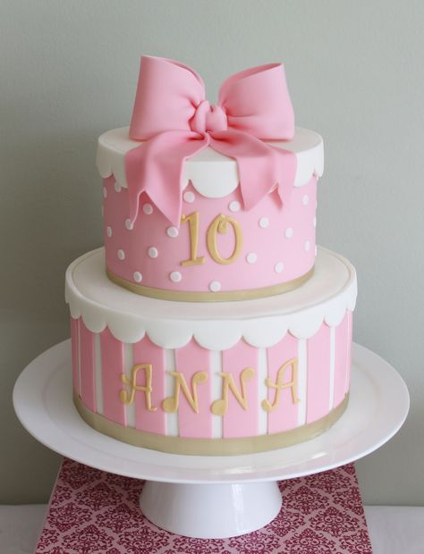 Birthday cake for my daughter turning 10.  Two tier cake with fondant candy stripes and suger bow topper. Part of my first dessert table. Birthday Cake Ideas Girl, Baby Shower Pasta, Fondant Girl, 10 Birthday Cake, Two Tier Cake, Girly Cakes, Birthday Cake Ideas, Baby Cakes, Girl Cake