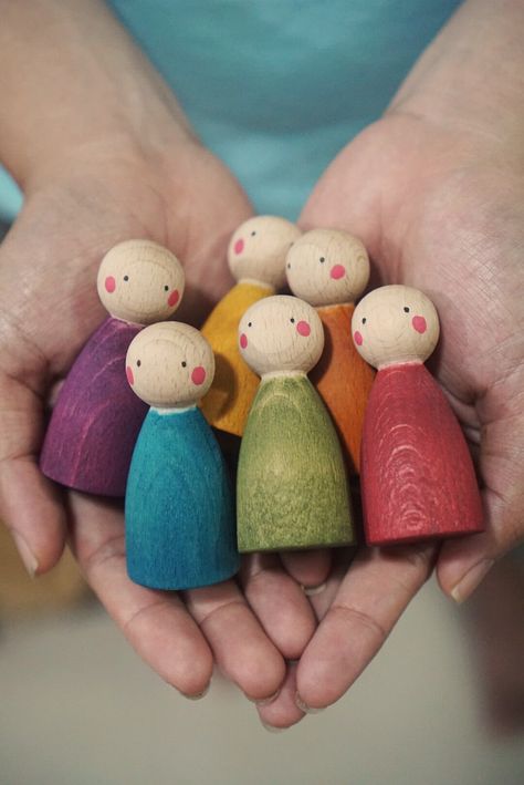 Set of 12 colorful wooden peg dolls from beech wood. Children can do role-play with peg dolls, put peg dolls in to the rings, matching color, unlimited possibility. They will get entertained while improving their fine motor skills, emotional intelligence, and language skills. Size: peg dolls: height 6.5cm, diameter 3cm Peg dolls are made from beech wood, colored with water-based color stains. We use non-toxic stains instead of acrylic/regular paints so children can still see the grains and feel Diy Montessori Toys, Rings Matching, Wooden Peg Dolls, Wood Peg Dolls, Peg People, Operation Christmas Child, Wooden Pegs, Waldorf Dolls, Wooden Dolls