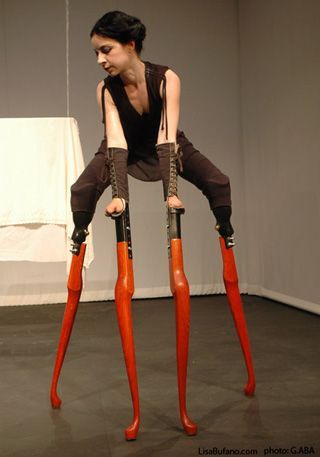 Lisa Bufano is an interdisciplinary artist and a performer, originally from Boston, Massachusetts, who often uses prosthetics and props in her work. Prosthetic Leg, Bionic Woman, Pretty Halloween, Table Leg, Pinturas Disney, Performance Artist, Stilts, Modern Dance, Wooden Table