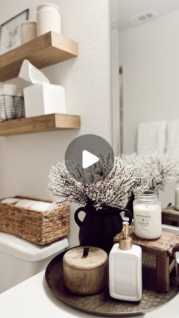 Nina Humes on Instagram: "flashback friday ✨🤍🌿  to this shelf decor in my guest bathroom. Decorated this space with so many budget friendly finds too!  details: + black vase, toilet paper holder, brass tray: Walmart + shelves, black wire basket, canisters, shower curtain: Target + curtain rod, rings, wood pedestal, tissue box cover, soap dispenser: Amazon  Everything here is linked in my bio and LTK! 🤍  Follow my shop @diariesofmyhome on the @shop.LTK app to shop this post and get my exclusive app-only content!  #liketkit #LTKhome  @shop.ltk https://liketk.it/4q74a . . . . . #homedecor #flashbackfriday #bathroomdecor #bathroomdetails #bathroomstyling #guestbathroom #guestroomdecor #affordablehomedecor #budgetfriendlydecor #boujieonabudget #bathroomstyling #halfbath #powderroom #smallbat Guest Bathroom Ideas Decor, Walmart Shelves, Bathroom Tray Decor, Wood Canisters, Black Wire Basket, Bathroom Tissue Holder, Shaker Village, Eclectic Wallpaper, Boho Farmhouse Decor