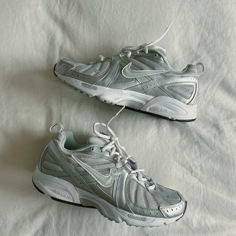 Silver Y2K Nike lifestyle sneakers Size 10W $40 Comment “I want it” or dm me if you would like to buy these shoes 🤍 Retro Nike Shoe, Nike Vintage Shoes, Retro Nike Shoes, Vintage Nike Shoes, Nike Lifestyle, Silver Y2k, Pretty Sneakers, Y2k Shoes, Lifestyle Sneakers