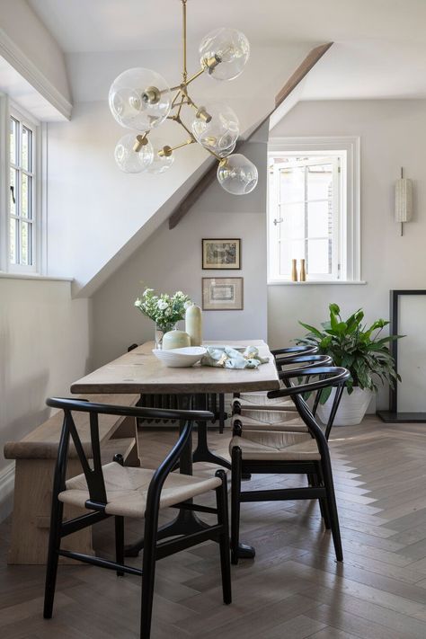 Dining table, 4 black rattan dining chairs and wooden bench in this apartment interiors. This gorgeous chandelier with 7 glass bolles and gold structure. And lets not forget this gorgeous chevron floor. #interiordesign #diningroom #formaldining Black Wood Chairs, Wishbone Chair Dining, Decor And Organization Ideas, Scandinavian Kitchens, Wooden Dining Table Designs, Scandinavian Kitchen Design, Wood Chairs, Wooden Dining Table, Kitchen Cabinet Styles