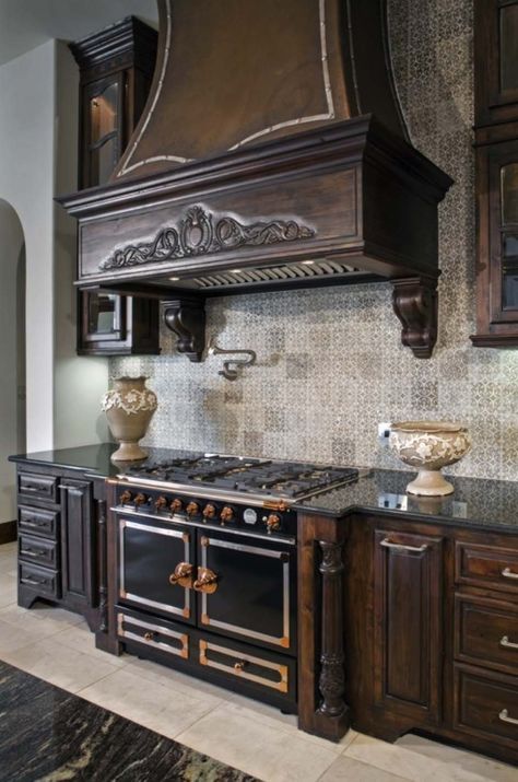 Enormous hand-carved vent over black oven. Spanish Style Ranch Homes, Santa Barbara Style Homes, Marble Tile Backsplash, Spanish Style Architecture, Santa Barbara Style, Fabulous Kitchens, Kitchen Cabinet Styles, Texas Hill Country, Interior Design Portfolio