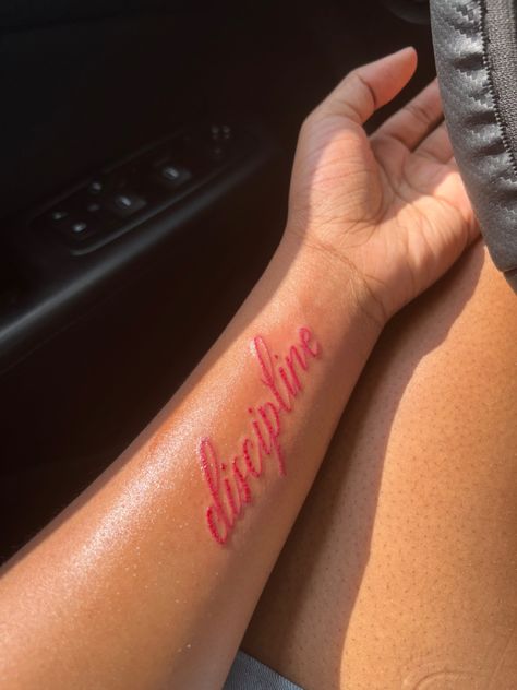 Red Ink Lettering Tattoo, Red Tattoos For Men, Red Tattoos Aesthetic, Men Red Tattoo, Red Font Tattoo, Red Inner Arm Tattoo, 1 Of 1 Tattoo Red Ink, Self Discipline Tattoo, Red Cursive Tattoo