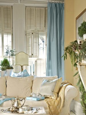 Hints of Blue  This otherwise neutral living room benefits from a hint of dressiness with curtains of soft blue raw silk. To invite cuddling up, use white slipcovers in soft, easy fabrics, like the brushed cotton on this sofa in the den, and layer on pillows and throws. Blue Curtains Living Room, Blue Living Room Decor, Yellow Living Room, Coastal Living Rooms, Blue Curtains, Curtains Living, Neutral Living Room, Yellow Walls, Blue Living Room