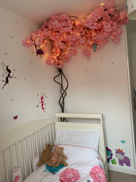 Flowers On Roof Bedroom, Cherry Blossom Led Lights Diy, Hanging Flower Wall Bedroom, Sakura Bedroom Aesthetic, Cherry Blossom Tree Bedroom, Pink Fairy Room, Cherry Blossom Room Aesthetic, Cherry Blossom Wall Decor, Encanto Bedroom Ideas