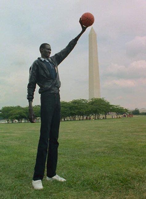 Meet the tallest people in Africa, the Dinka tribe (Jieeng) | The African History Manute Bol, Man Hug, Basketball Players Nba, Tall People, A Basketball, African History, World Of Sports, College Basketball, Nba Players