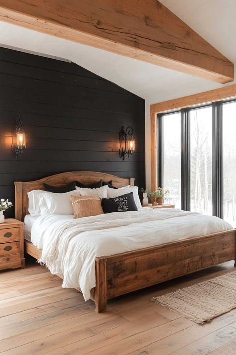 Cozy rustic bedroom featuring a striking black accent wall and wooden decor elements. Black Wood Plank Wall, Bedroom Interior Dark Theme, Black Shiplap Bedroom Wall, Painted Wood Accent Wall Bedroom, Master Bedrooms With Accent Wall Shiplap, Black Wall In Master Room, White Walls With Black Accent Wall, Room With One Black Wall, White Wood Accent Wall Bedroom