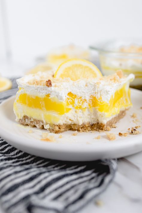 Lemon Lush Dessert is a fantastic recipe featuring my favorite flavor, lemon! Some call this favorite recipe Lemon Lasagna, others might refer to it as a Lemon No Bake Dessert Recipe Lemon Pretzel Dessert, Lemon Lasagna Dessert, No Bake Lemon Desserts, Lemon Lush Recipe, Lemon Lasagna, Lemon Lush Dessert, Lush Dessert, Lush Cake, Lush Recipes