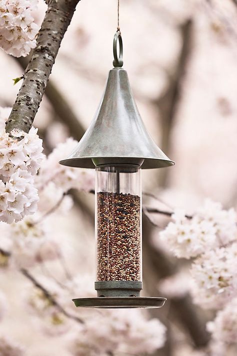 A pagoda-style, verdigris copper roof and feeding tray lend polish to this hand-crafted bird feeder for the garden. | Verdigris Peak Bird Feeder at Terrain Rustic Bird Feeders, Modern Bird Feeders, Metal Bird Feeders, Iron Trellis, Hanging Bird Feeder, Garden Obelisk, Modern Pot, Trough Planters, Organic Ceramics