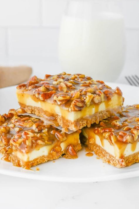 This delicious pecan pie cheesecake bar recipe is a wonderful fall dessert that falls under the category of, if you can't pick just one, have them both! That's right, we can have our cake and eat it too. With pie! No Bake Pecan Cheesecake Bars, Potluck Desserts Fall, Thanksgiving Pecan Desserts, Pecan Pie Dessert Ideas, Easy Fall Potluck Recipes, Thanksgiving Desserts Pecan, Quick And Easy Thanksgiving Desserts, Pecan Pie Cheesecake Bars Recipe, Pecan Cheesecake Pie