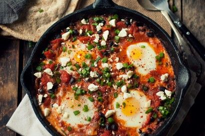 A southern take on a Tunisian comfort staple. Eggs baked in a spicy black bean-studded marinara. Shakshuka With Feta, Sicilian Meatballs, Eggs In Tomato Sauce, Feta And Olives, Shakshuka Recipes, Sausage Bake, Olive Recipes, Breakfast Eggs, Peanut Butter Oatmeal Cookies