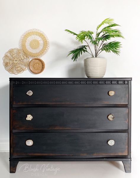 Blush Vintage painted this simple chest of drawers using Chalk Paint® furniture paint by Annie Sloan in Athenian Black. They then rubbed back the paint tor eveal the golden brown wood underneath and give a distressed look. The handles are finished as slices of quartz stone. Love the black with the green of the plant and raw material of stone and woven decorative plates. Annie Sloan Athenian Black, Black Chalk Paint Furniture, Greek Ceramics, Black Painted Furniture, Guest Bedroom Design, Black Chalk Paint, Chalk Paint Colors, Refinished Furniture, Annie Sloan Paints