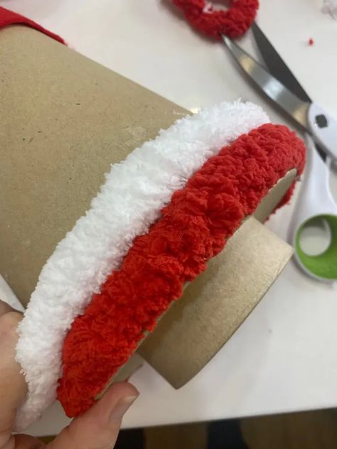 adding red and white chunky yarn to a cardboard cone to make a candy cane tree Candy Cane Wreath With Yarn, Chunky Yarn Craft Ideas, Yarn Wrapped Christmas Tree Diy, Crafts With Chunky Yarn, Chunky Yarn Trees Christmas Diy, Candy Cane Gnome, Candy Cane Yarn Wreath, Decorating With Candy Canes, Chunky Yarn Trees