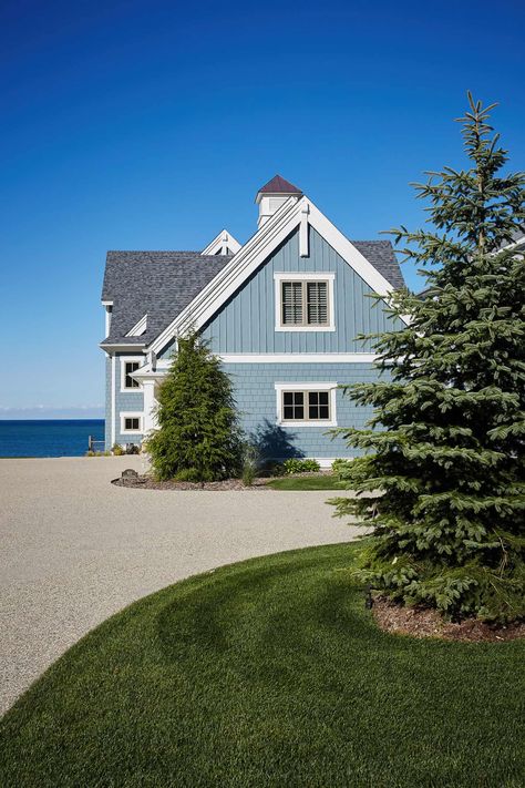 Tour a cozy lake cottage in Michigan with nautical inspired interiors Seaside Cottage Interior, Lake House Exterior, Cozy Lake House, Michigan Lake House, Michigan Cottage, Saugatuck Michigan, Outdoor Covered Patio, Lake Houses Exterior, Lake Michigan Beaches