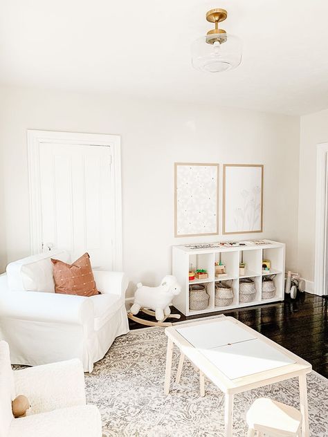 White Playroom Storage, Playroom Off Entryway, Aesthetically Pleasing Playroom, Office With Playroom, Playroom Living Room Ideas, Playroom Living Room Combo Layout, Sitting Room Playroom Combo, Montesorri Playroom Ideas Modern, Minimalist Playroom Ideas