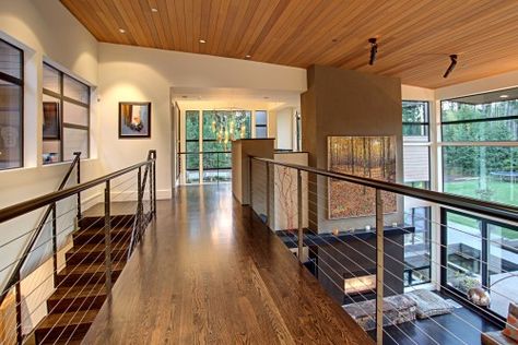 upstairs balcony overlooking living room/dining room & kitchen. Living Room With Mezzanine, Interior Railings, Contemporary Stairs, Wooden Ceilings, Railing Design, Floor Colors, Forest House, Contemporary Living Room, Residential Architecture