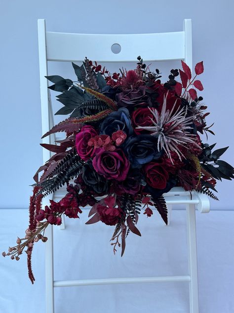 Custom Realistic Artificial Boho Style Burgundy & Black Cascading wedding bouquet This stunning bouquet has been custom made with quality silk, real touch flowers & foliage. This bouquet is approximately 20 x 12 inches (50x 30cm) Matching Bridal posies & other items are also available on another listing in our shop Black Flower Bouquet, Eccentric Wedding, Vampire Life, Burgundy Bridal Bouquet, Dark Wedding Theme, Cascading Bridal Bouquets, Cascading Wedding Bouquets, Fav Products, Lily Bouquet