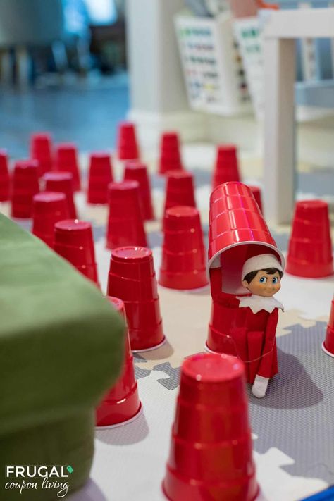 Fill your Red SOLO Cup with a North Pole friend. In this cute hiding Elf on the Shelf Cup game, see if your child can find the family elf. Print our cute rhyming Elf on the Shelf Letters to the kids too! New Elf on the Shelf ideas daily plus free Elf on the Shelf printables. #FrugalCouponLiving #ElfontheShelf Elf On The Shelf Mini Red Solo Cups, Solo Cup Elf On The Shelf, Elf On The Shelf Ideas With Cups, Red Solo Cup Elf On The Shelf, Elf On The Shelf Cups, Elf On The Shelf Red Solo Cups, Elf On The Shelf Solo Cups, Elf Shelf Arrival, Elf On The Shelf Letters