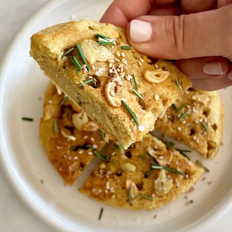 close-up holding a wedge of focaccia-style skillet chickpea flatbread Flatbread Toppings, Leavened Bread, Chickpea Flatbread, Unleavened Bread, Garlic Chips, Lemon Dill Sauce, Sauteed Greens, Zucchini Fritters, Focaccia Bread