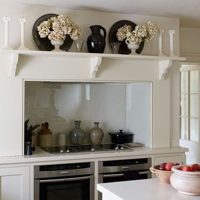 Shelf appeal.  Very pretty shelf over the cooking area.  Nicely accessorized too. Creates a stunning impact to your cooking area of the kitchen. Kitchen Mantle, Galley Wall, Stylish Kitchen Design, Wall Stove, Kitchen Design Gallery, Diy Kitchen Renovation, Range Cooker, White Modern Kitchen, Double Oven