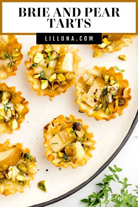 Decadent Brie and Pear Tarts are elegant, delicious, and ready in under 20 minutes! Dazzle your guests with these refined hor d'oeuvres. #brieandpeartarts #brie #peartart #tart #appetizers Brie And Pear, Pear Tarts, Pear Tart Recipe, Mini Tart Shells, Buffalo Chicken Bites, Brie Puff Pastry, Brie Appetizer, Puff Pastry Crust, Brie Bites