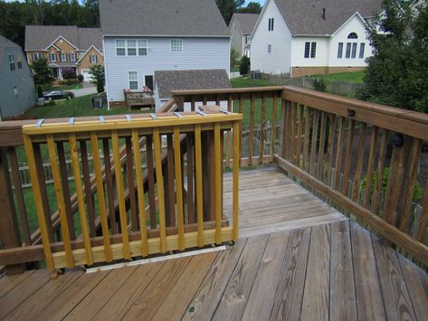 sliding deck gate | sliding on wheels diy wooden deck gate looks like here it is Diy Sliding Gate, Outdoor Pet Gate, Porch Gate, Deck Gate, Vinyl Deck, Stair Gate, Wooden Deck, Deck Posts, Wooden Porch