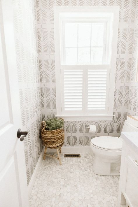 White Bathroom With Wallpaper, Grey Pattern Wallpaper, Willow Project, Black Fireplace Surround, Coastal Powder Room, Gray Wallpaper Bathroom, Serena And Lily Wallpaper, Round Wood Mirror, Coastal Gallery Wall