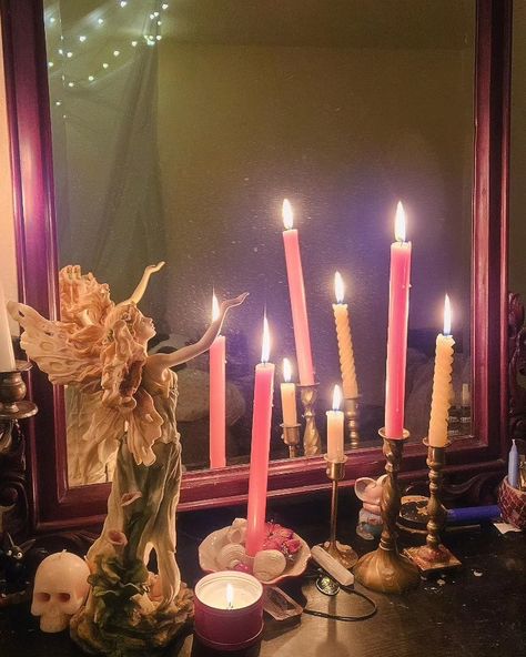 Several pink candles are lit next to a mirror and fairy statue. Pink Altar Aesthetic, Light Witchy Aesthetic, Pink Witchy Room, Fairy Alter, Pink Candle Magic, Pink Magic Aesthetic, Feminine Altar, Pink Witch Aesthetic, Practical Magic Aesthetic