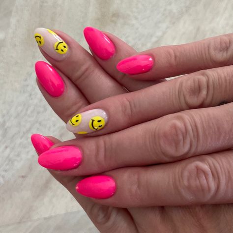 Neon pink nails with one smiley face finger. Preppy Nails With Smiley Face, Happy Face Nails Acrylic, Round Neon Nails, Smile Face Nail Art, Hot Pink Nails With Smiley Face, Pink Happy Face Nails, French Nails With Smiley Face, Happy Face Nail Designs, Pink Nails Smiley Face