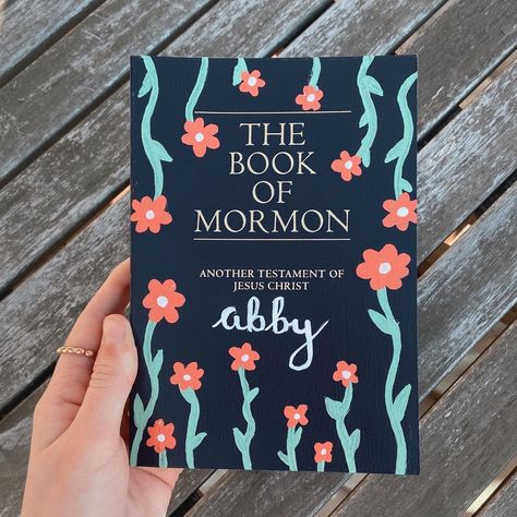 Painting On Books Covers, Book Of Mormon Painted Cover Ideas, Painted Book Of Mormon Cover Ideas Easy, Decorated Book Of Mormon Cover, Painted Books Of Mormon, Book Of Mormon Painting Ideas, Painted Book Of Mormon Cover For Boys, Simple Book Of Mormon Painting, Book Of Mormon Painted Cover Simple