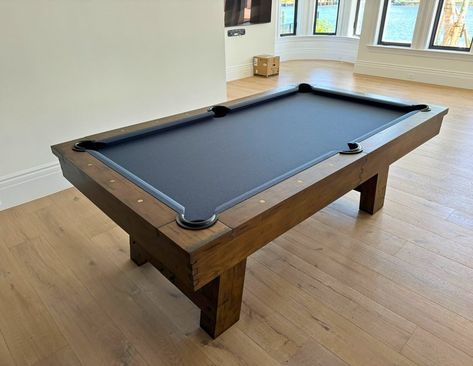 Introducing the exquisite Isaac Slate Pool Table by Plank & Hide, crafted exclusively for Sawyer Twain. Featured in distressed brown with golden turnbuckles, this stunning high end pool table perfectly complements the blue wall interior design of this Miami, Florida home. Complete with a dining top option, it’s time to let the good times roll just in time for summer. Elevate your interior design with this beautiful addition to any custom home. #SawyerTwain #PlankAndHide #PoolTable #LuxuryLi... Blue Wall Interior Design, Blue Wall Interior, Cove Lights, Slate Pool, Pool Table Slate, Wall Interior, Cove Lighting, Let The Good Times Roll, Interior Wall Design