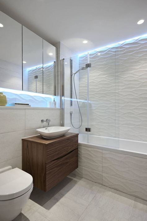 Bathroom Tile Ideas - Install 3D Tiles To Add Texture To Your Bathroom // The cool lights above the wavy tiles make this bathroom look like it's living under water. Bathtub Shower Combo, Toilette Design, Stunning Bathrooms, Bathroom Tub, Bathroom Shower Tile, Trendy Bathroom, Tub Shower Combo, Contemporary Bathrooms, Bathroom Layout