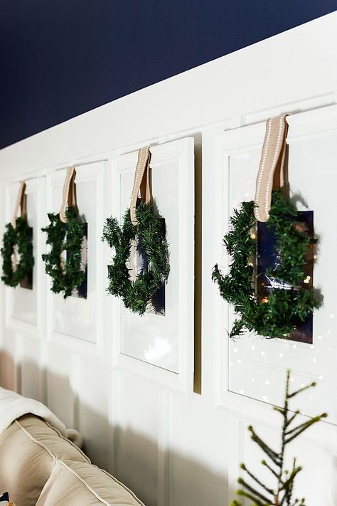 Simple neutral decorating idea for Christmas and through winter. Hang small simple wreaths over an existing gallery wall - Deck the Walls – 14 Inspiring DIY Christmas Wall Decor Ideas #WinterDecor #ChristmasWreaths #WinterGalleryWall Diy Christmas Wall Decor, Christmas Wall Decor Ideas, Simple Wreaths, Neutral Decorating, Christmas Wall Decor Diy, Diy Christmas Wall, Christmas Gallery Wall, Neutral Christmas Decor, Christmas Decor Inspiration